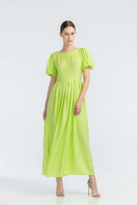 Світло-салатова сукня з V-подібним вирізом на спині 